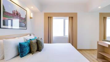 Suite ejecutiva, 1 habitación, vistas a la ciudad | 1 dormitorio, minibar, caja fuerte y escritorio
