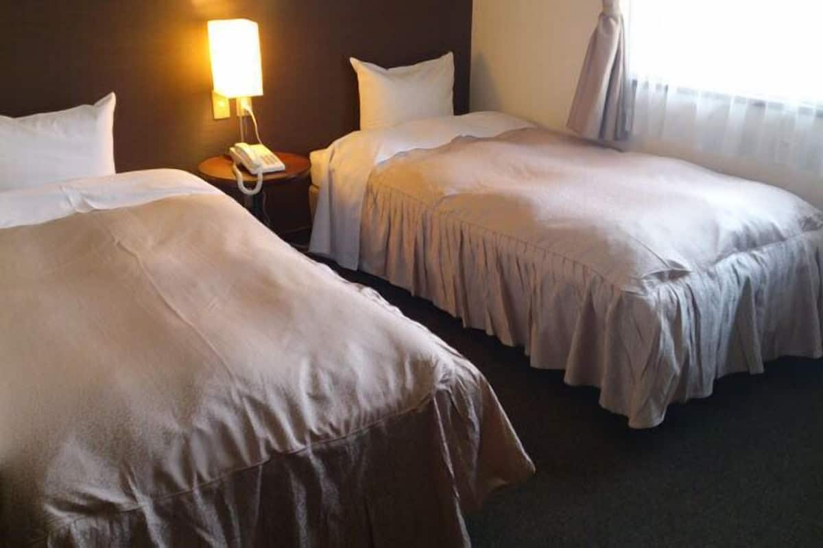 Eenvoudige Twin kamer | Gratis wifi, beddengoed