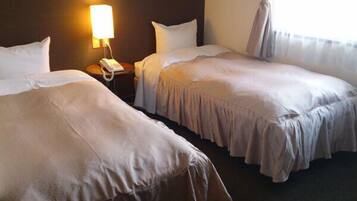 Habitación básica con 2 camas individuales | Wifi gratis y ropa de cama