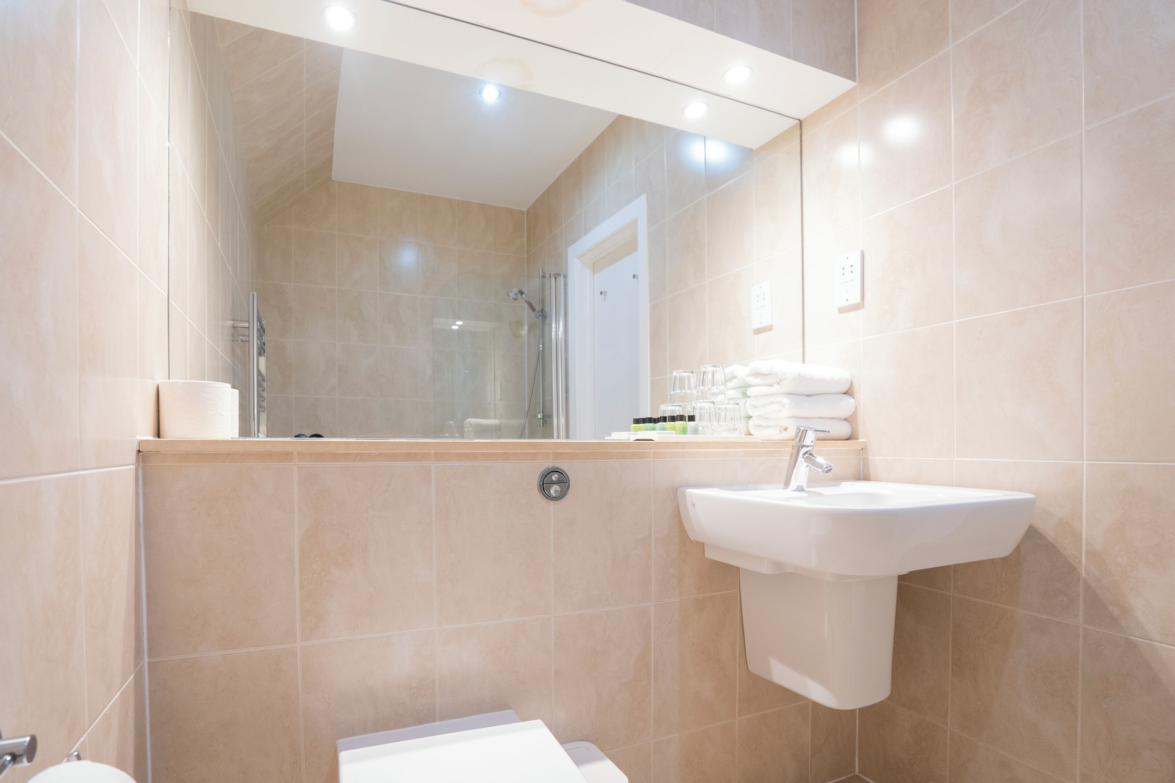 superior double room | bathroom | shower, free toiletries, hair dryer, towels
