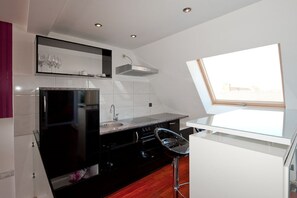 Loft luxo, 1 quarto, vista para a cidade | Cozinha privada