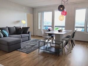Deluxe Apartment, Sauna, Lake View (A 23) | Living area | Flat-screen TV - The Harbour Apartments (Jyväskylä)