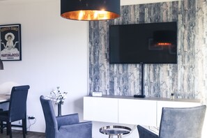 Deluxe Studio, 1 Bedroom, City View | Living area | Flat-screen TV