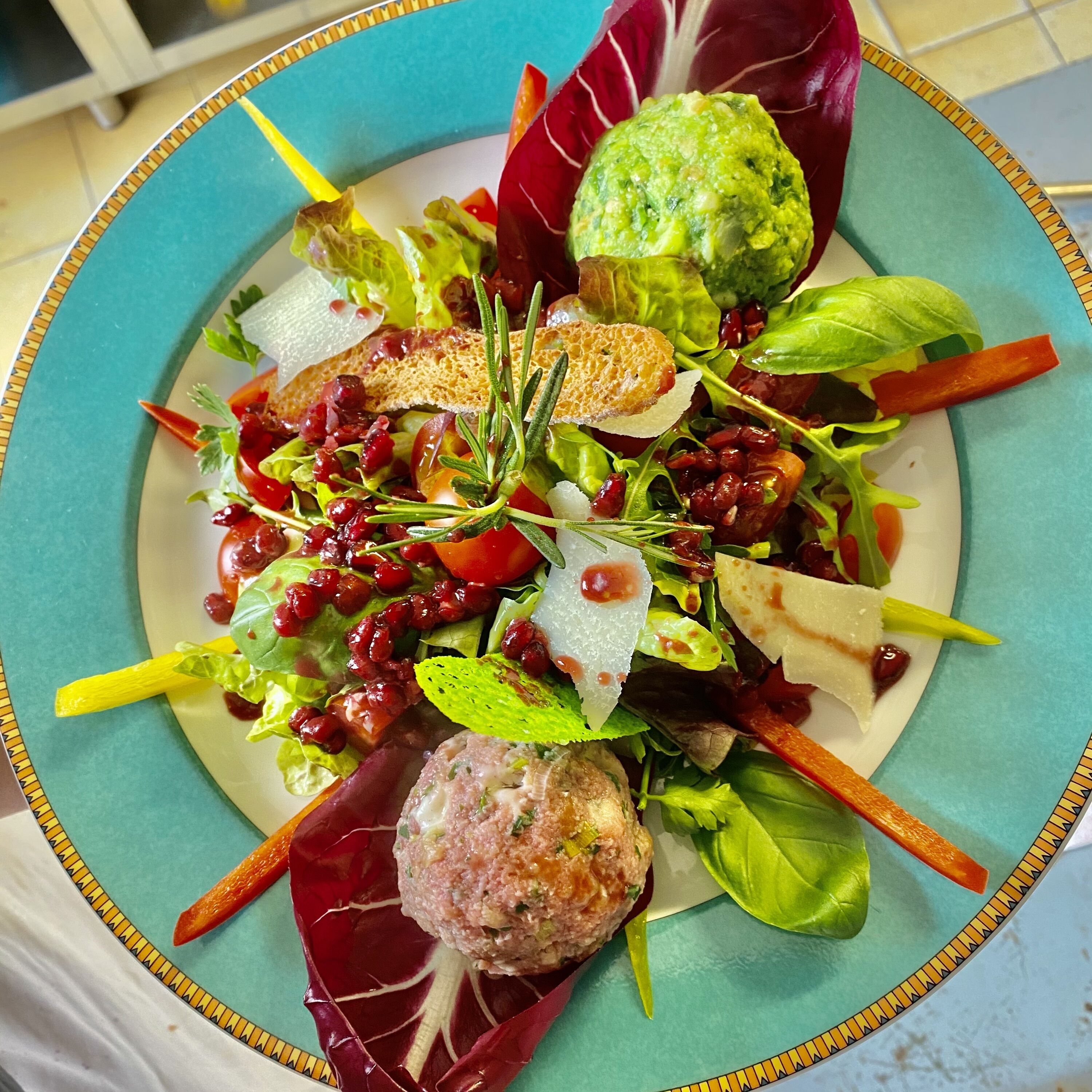 A plate of food with various ingredients and garnishes.
