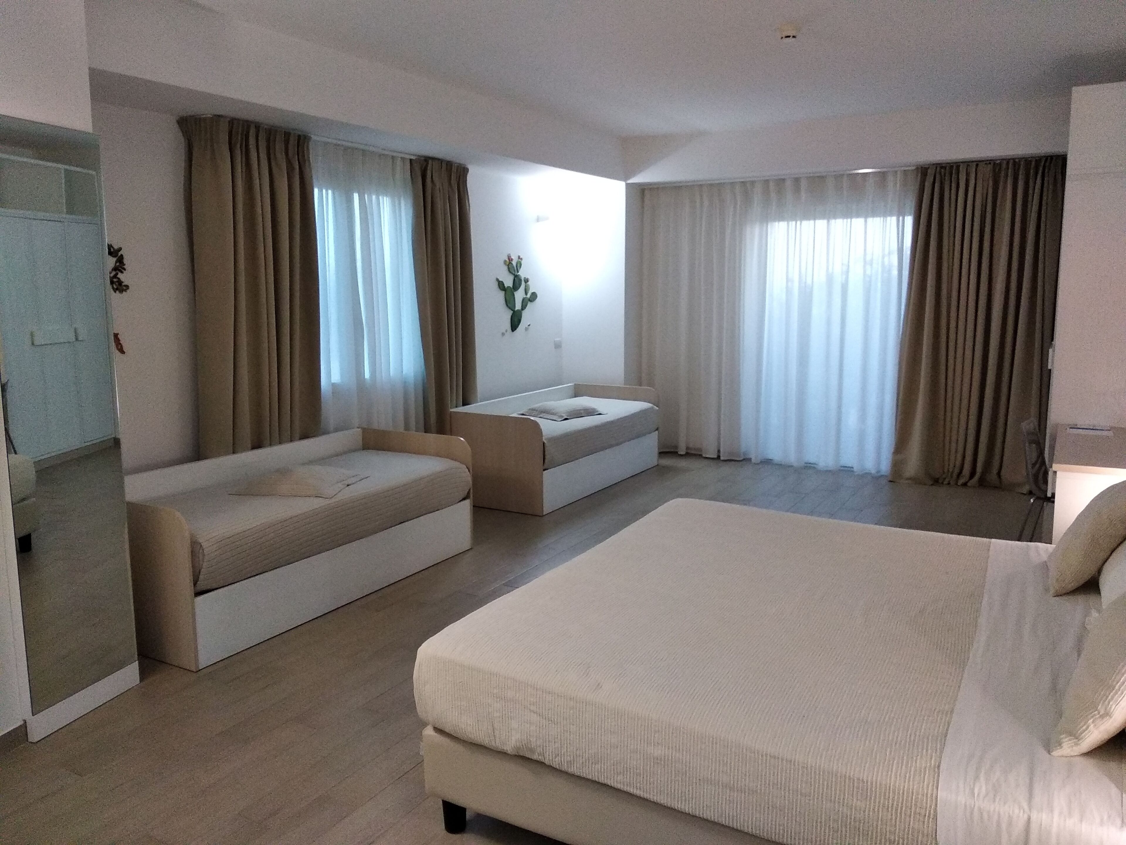 deluxe quadruple room, terrace | minibar, in-room safe, desk, free wifi