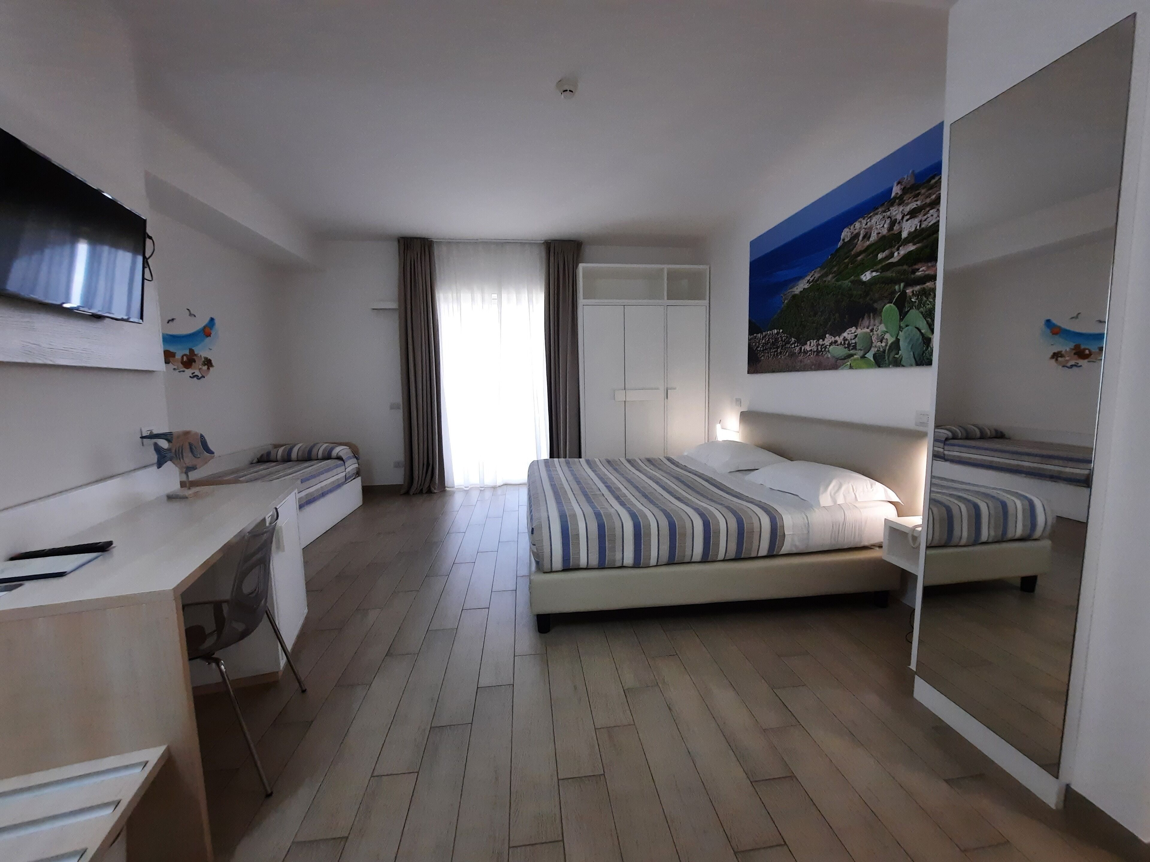standard triple room, balcony | minibar, in-room safe, desk, free wifi