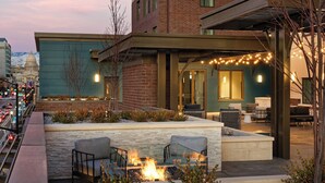 A rooftop patio with outdoor seating, a fire pit, and string lights. - Residence Inn by Marriott Boise Downtown City Center (Boise)