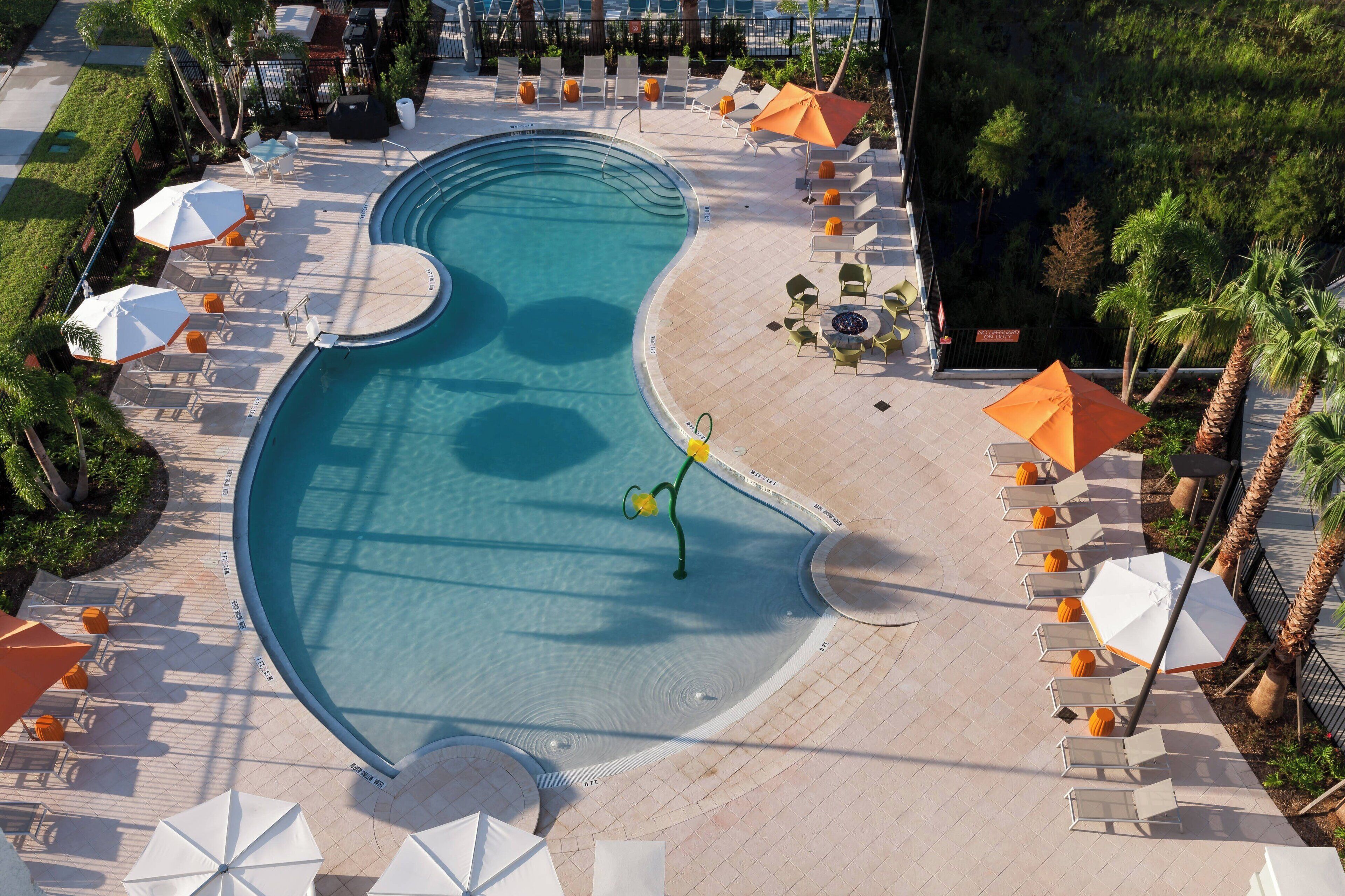 outdoor pool, open 8:00 am to 10:00 pm, pool umbrellas, pool loungers