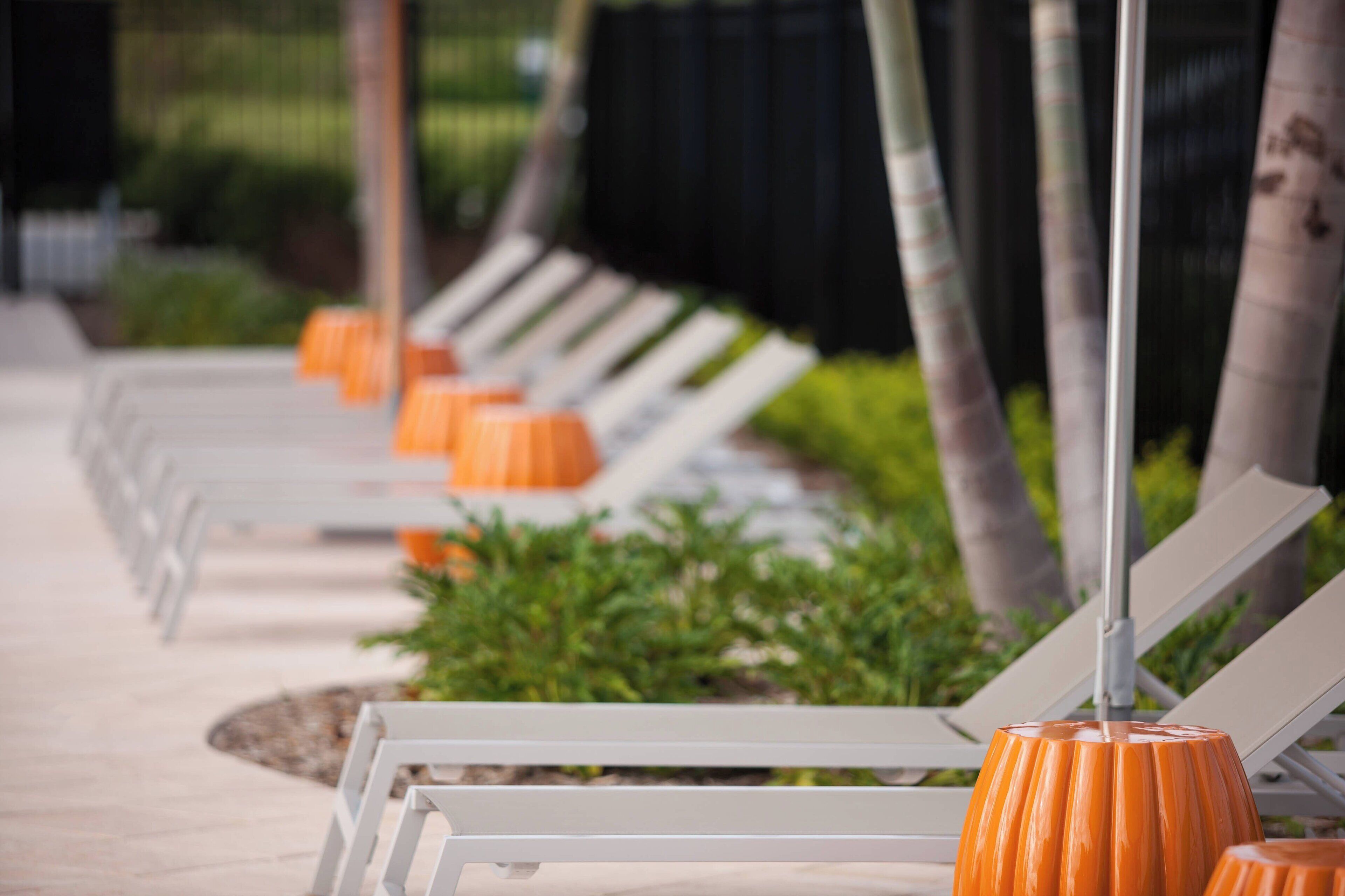 outdoor pool, open 8:00 am to 10:00 pm, pool umbrellas, pool loungers