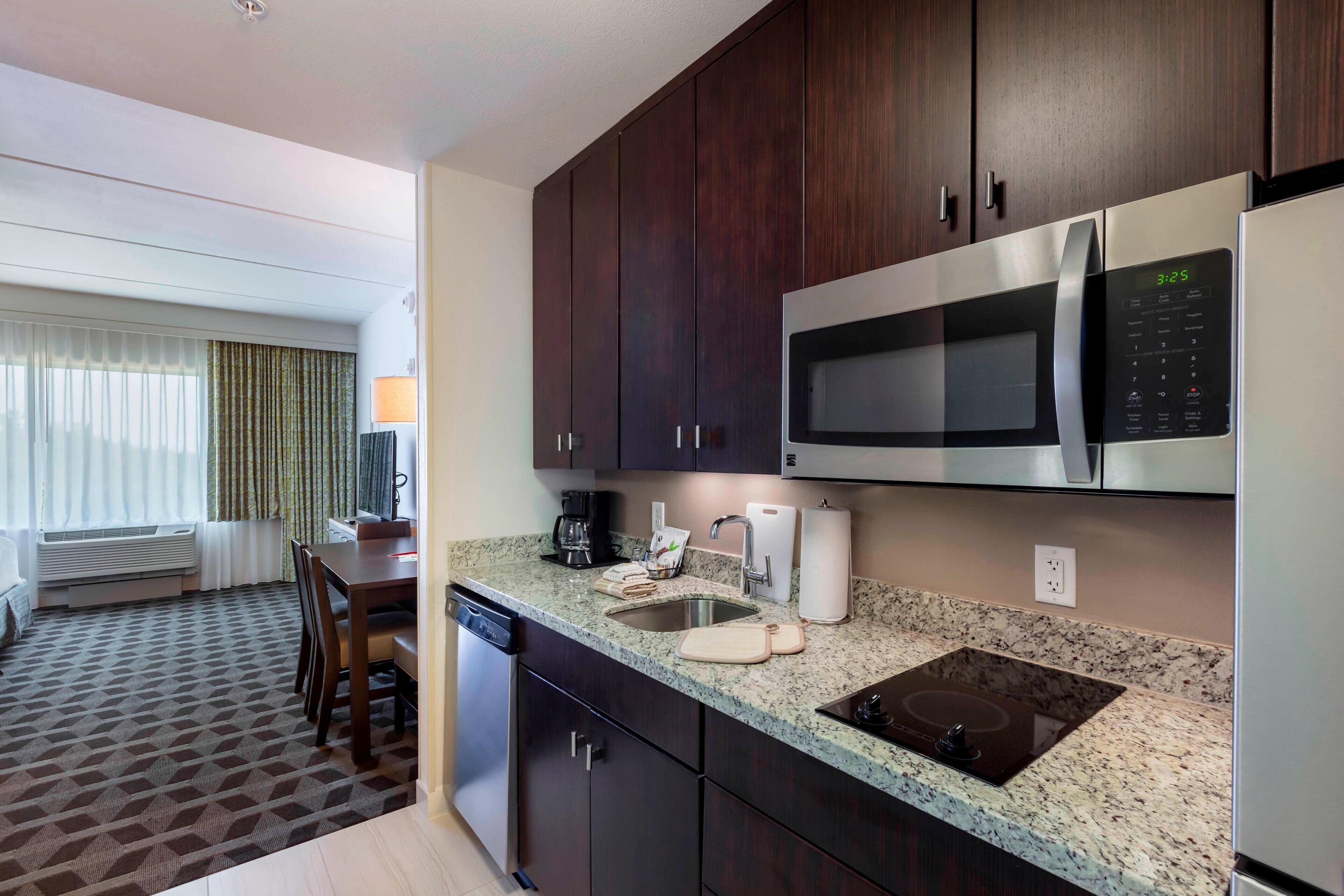 family studio suite, 1 bedroom | private kitchen | full-sized fridge, microwave, stovetop, dishwasher