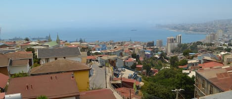A coastal town with a mix of residential buildings and a prominent church spire.