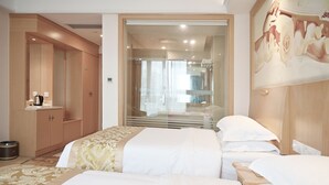 A hotel room with two beds, a wardrobe, a mirror, and a painting on the wall. - Royal International Hotel Disneyland and Wild Animal Park Branch (Shanghai)