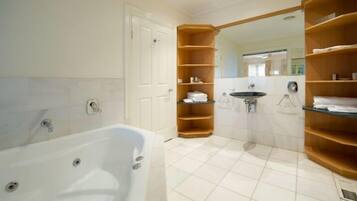 Suite | Bathroom | Separate bathtub and shower, hair dryer, towels, soap