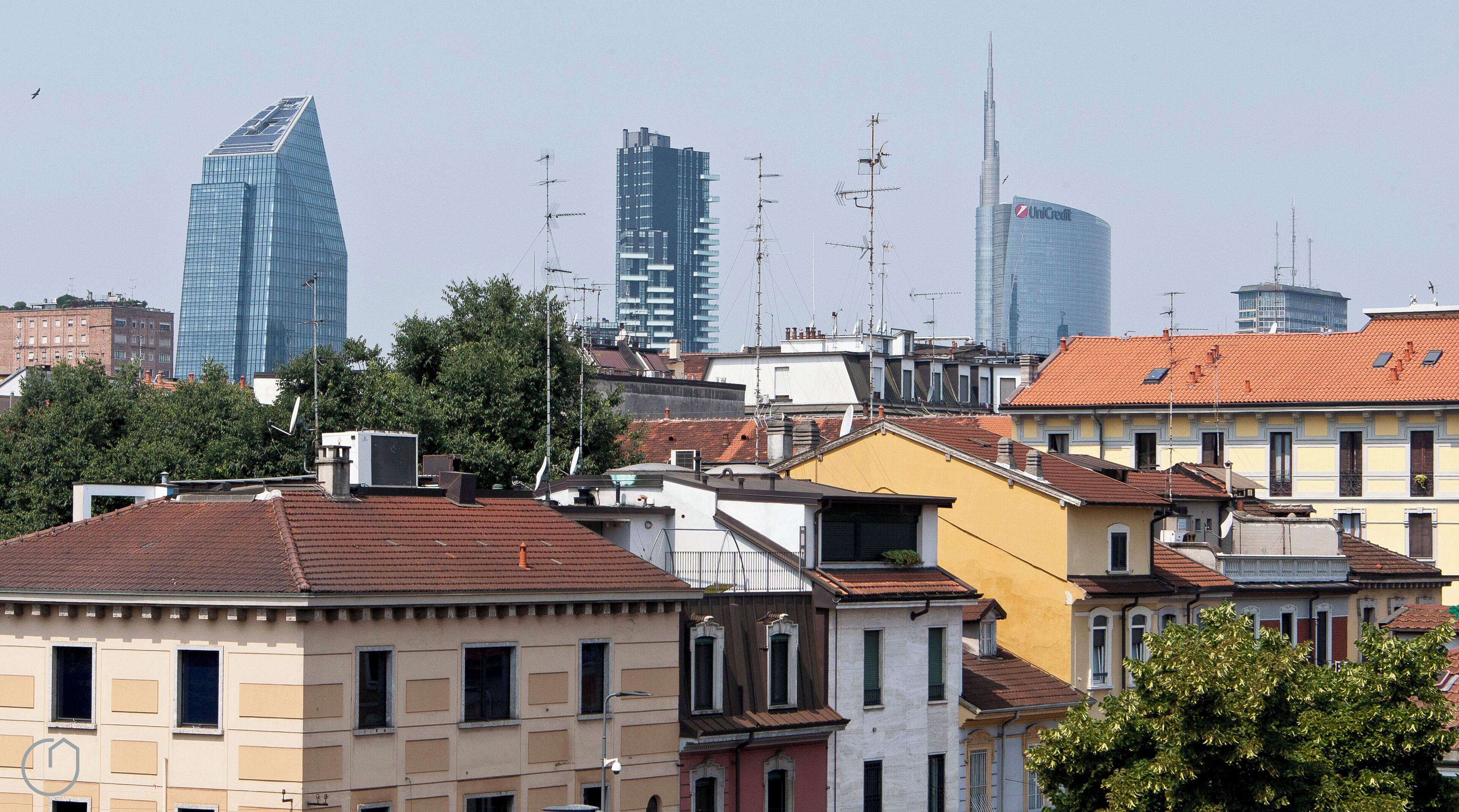 A cityscape with a mix of modern skyscrapers and traditional buildings.