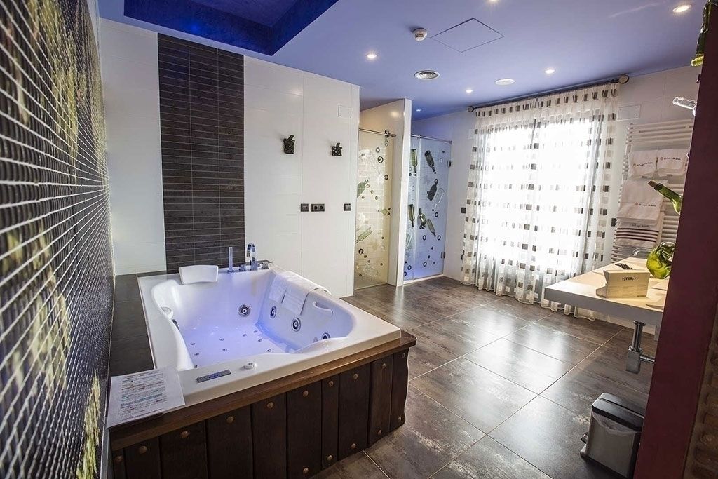 junior suite | bathroom | shower, designer toiletries, hair dryer, towels