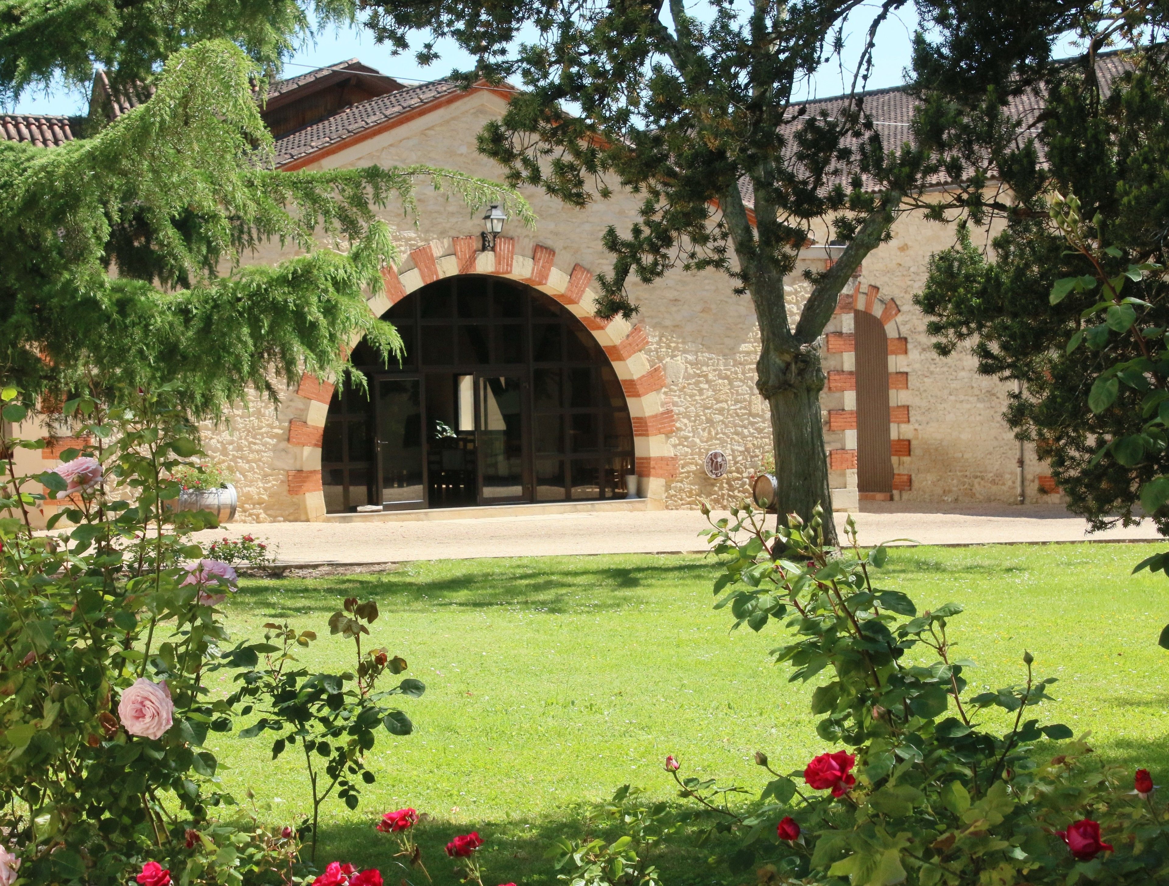 A building with a stone facade and arched entrance.