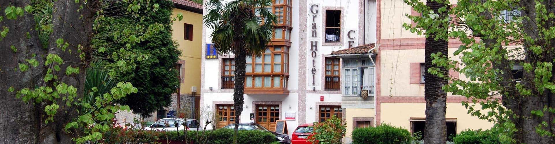A hotel with a traditional facade, multiple windows, and a visible entrance.