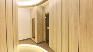 A corridor with wooden paneling and a curved ceiling.