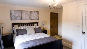 Deluxe Double Room (Room 5) | Premium bedding, desk, laptop workspace, iron/ironing board