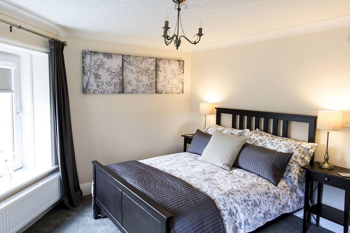 Deluxe Double Room (Room 4) | Premium bedding, desk, laptop workspace, iron/ironing board