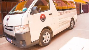 A white van with the text "CYPA HOTEL" and contact information on its side. - Cypa Hotel (Abidjan)