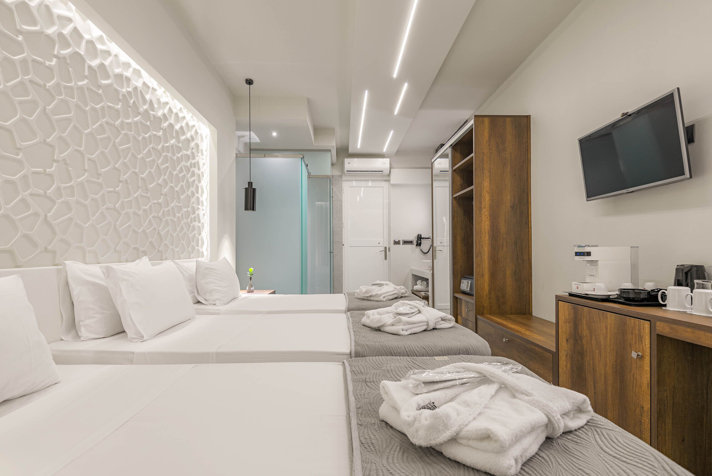 deluxe triple room | in-room safe, iron/ironing board, free wifi, bed sheets