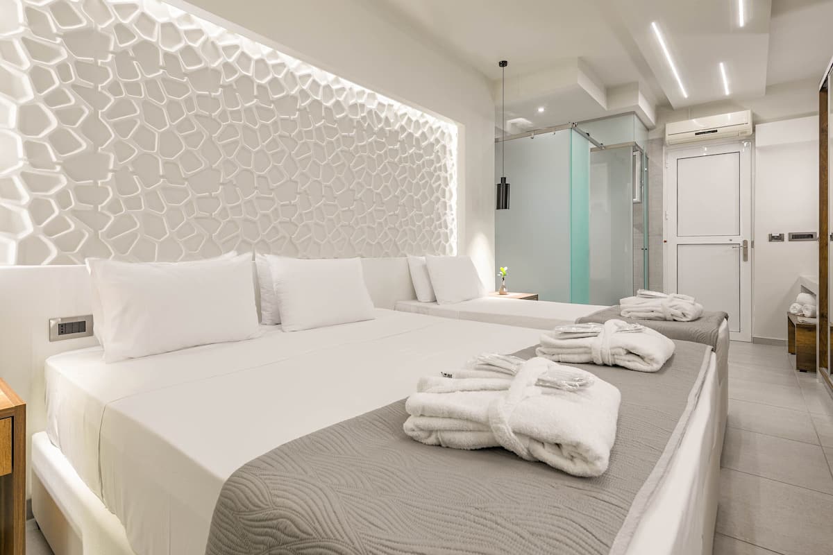 deluxe triple room | in-room safe, iron/ironing board, free wifi, bed sheets