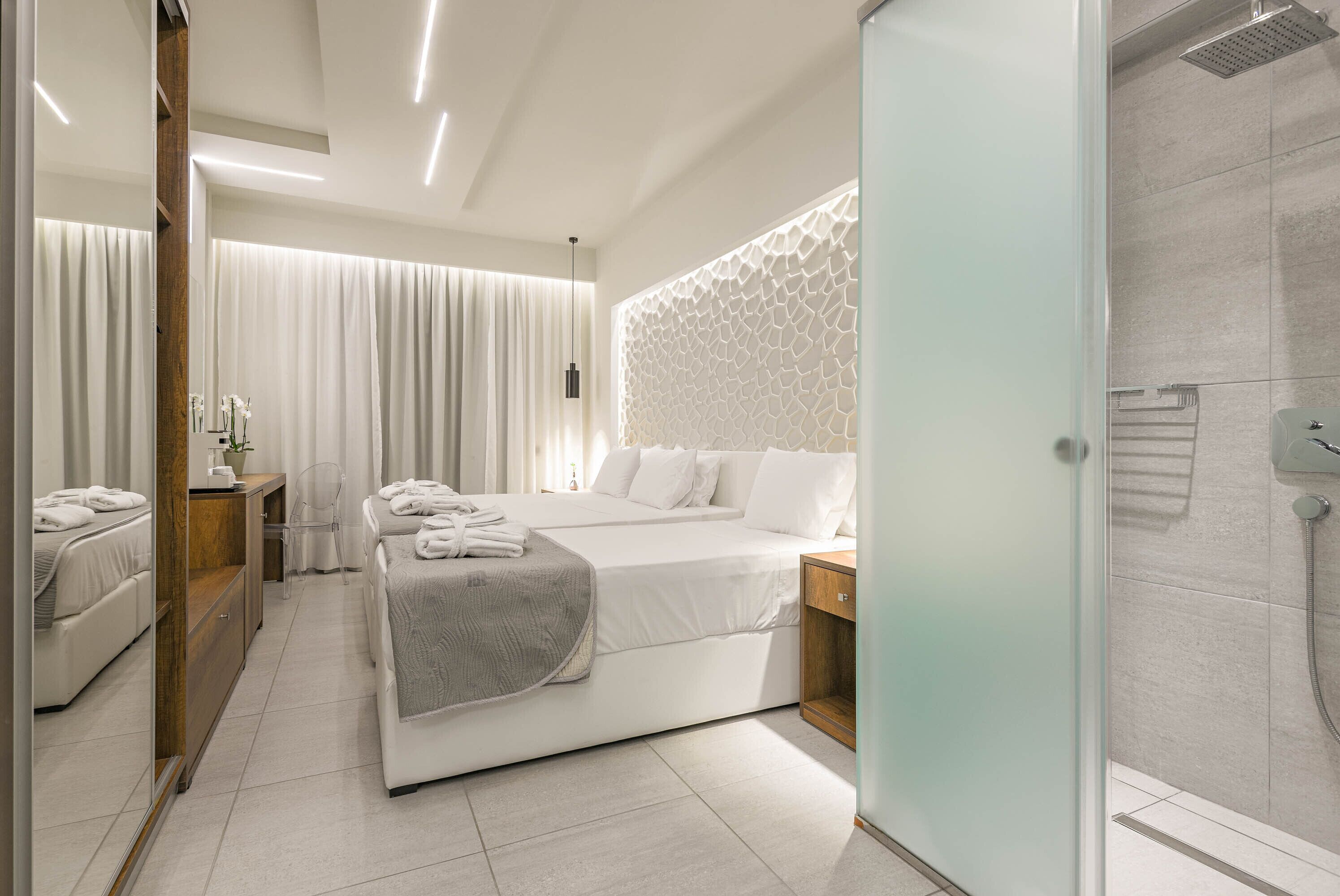 deluxe triple room | living area | flat-screen tv