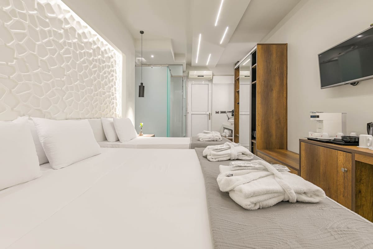 deluxe triple room | in-room safe, iron/ironing board, free wifi, bed sheets