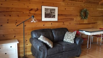 Cabin, 1 King Bed, Mountain View | Living area | 32-inch flat-screen TV with cable channels, TV