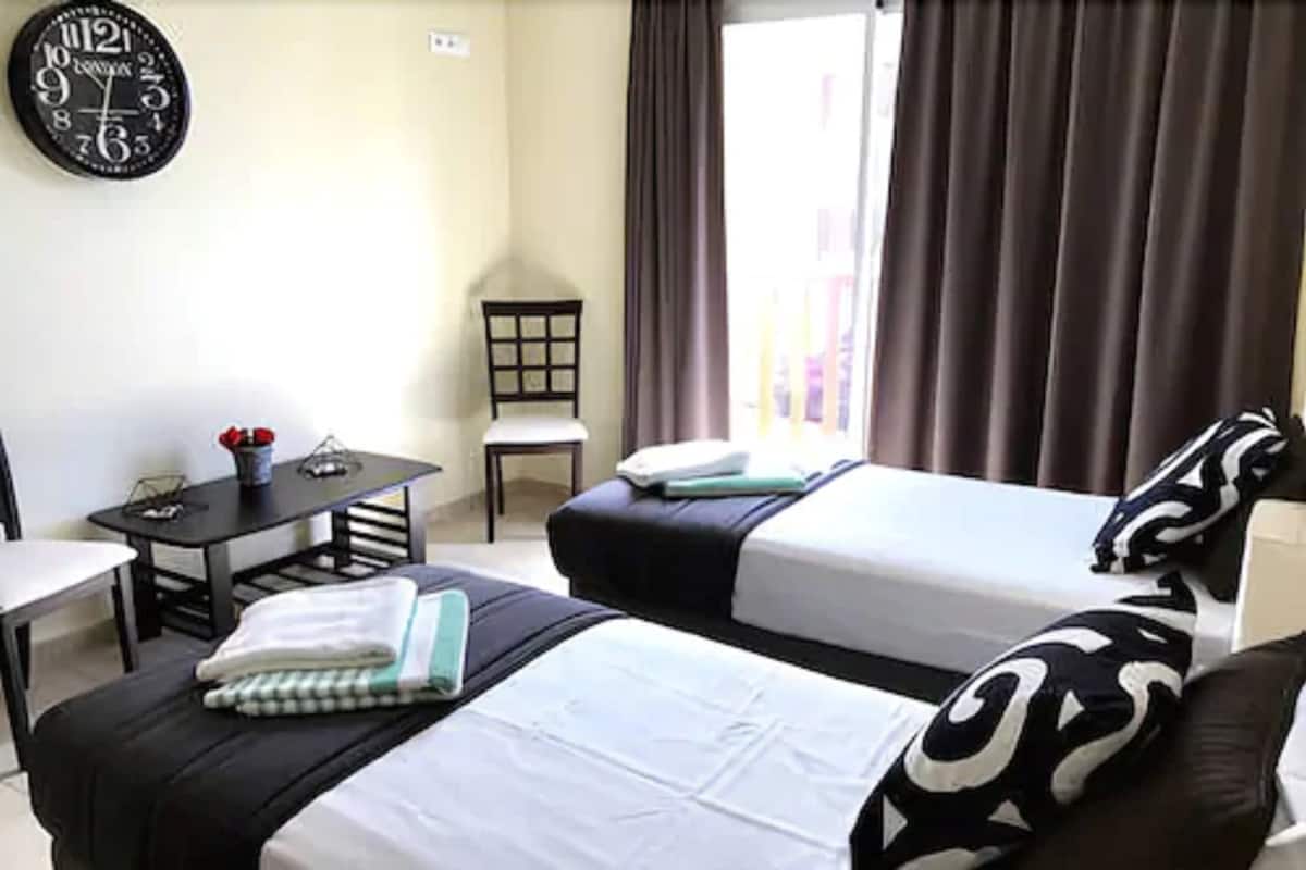 Condo luxo, 2 quartos, vista parcial para o oceano | Cofres nos quartos, ferros/tábuas de passar roupa, Wi-Fi de cortesia
