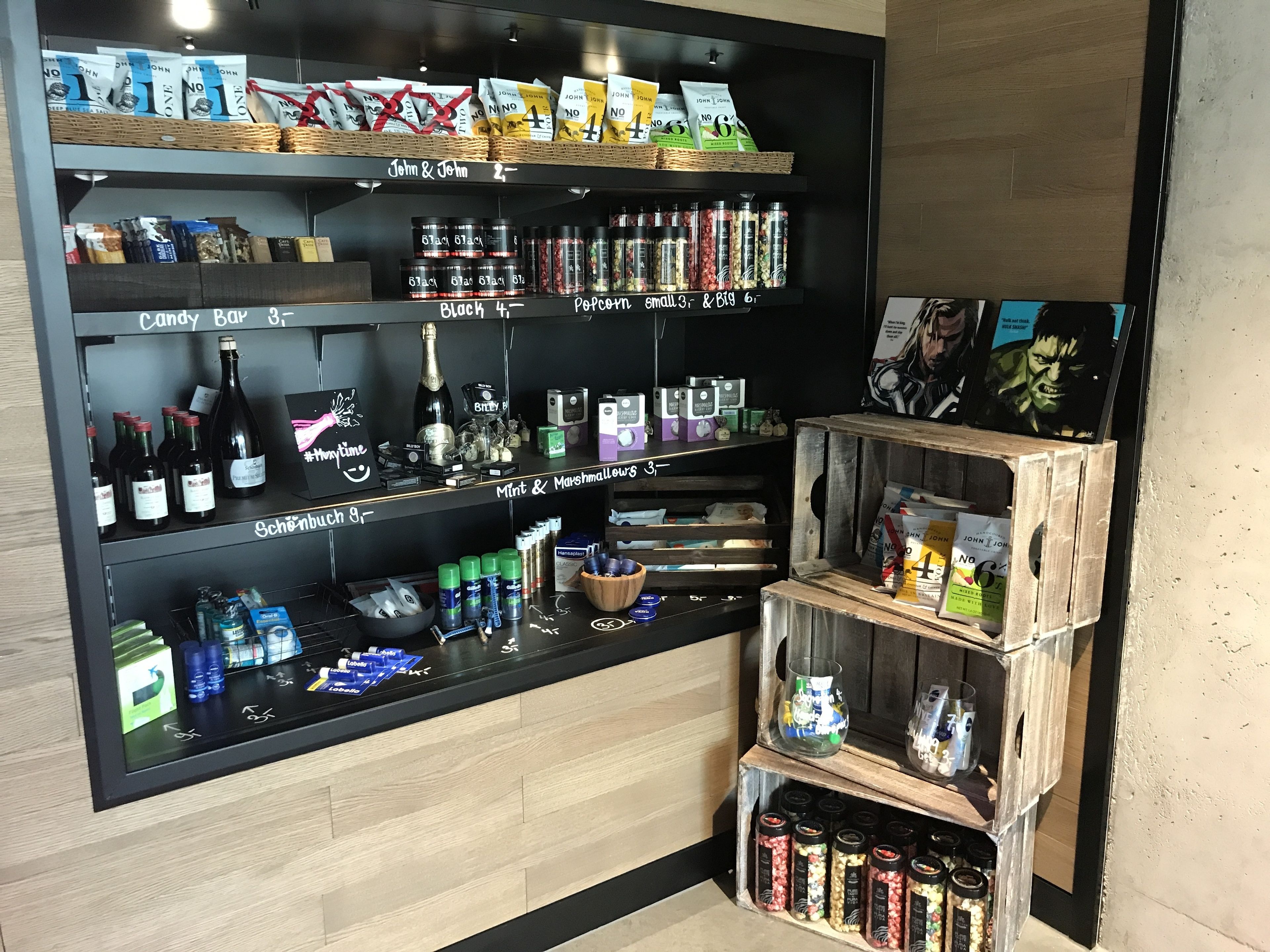 A well-organized beverage and snack display with various brands and types of products.