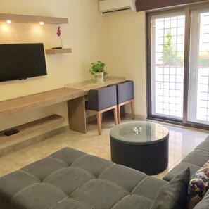 Deluxe-Apartment, 1 Schlafzimmer, Terrasse | Wohnbereich