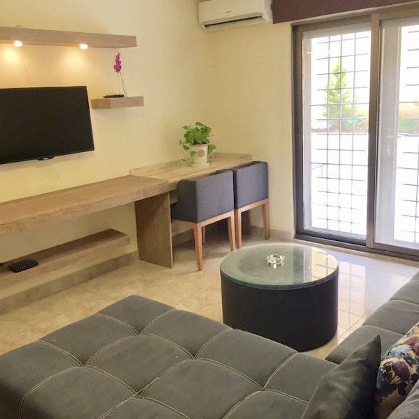 Appartement Deluxe, 1 chambre, terrasse | Coin séjour