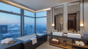 A modern bathroom with a large window, two sinks, a bathtub, and a city view. - AOLUGUYA · The Unbound Collection by Hyatt (Harbin)