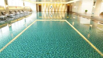 Relax by the pool with lounge chairs and a central swimming lane.