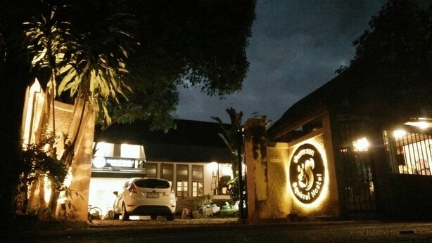 A building with a sign that reads "Mason Hotel." - Squirrel Hostel (Chiang Mai)