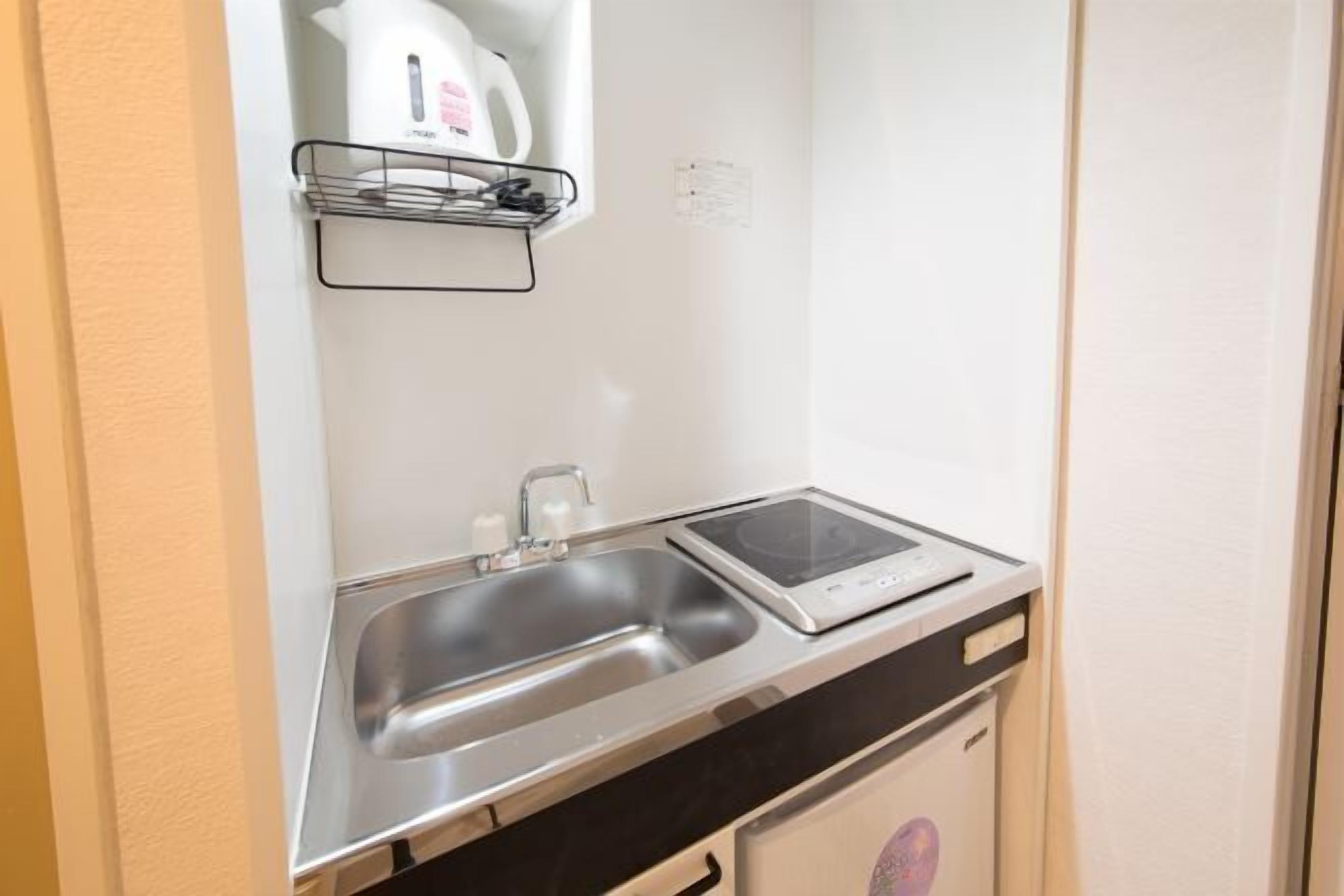 Fridge, microwave, electric kettle, cookware/dishes/utensils