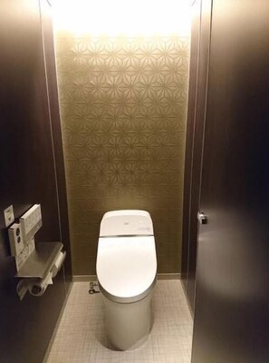 A small, enclosed bathroom with a toilet, a sink, and a mirror. - Cabinhouse Yado Fujinomiyaten (Fujinomiya)