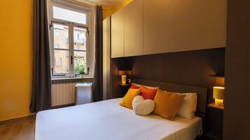 Apartamento, 1 habitación | 1 dormitorio, edredones de plumas, mobiliario individual y escritorio