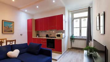 Apartment, 1 Bedroom | Living area | Flat-screen TV