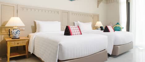 A hotel room with two beds, a decorative wall piece, and an air conditioning unit.