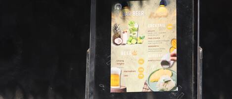 A menu board with various drink options and prices.