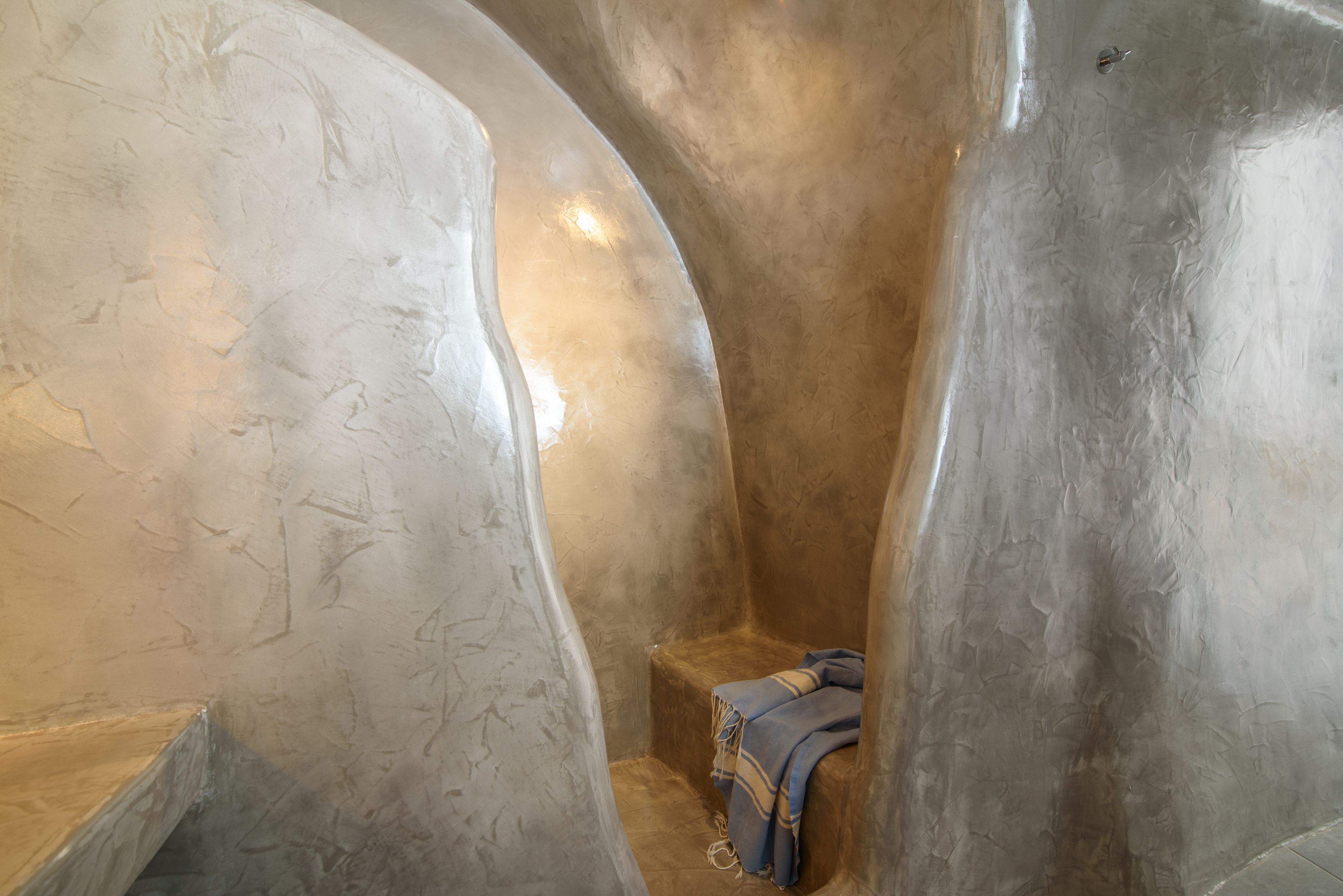 family suite with caldera view and private jacuzzi | bathroom | shower, rainfall showerhead, designer toiletries, hair dryer