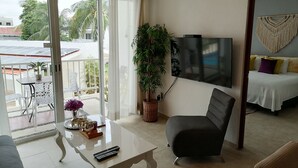 Basic Apartment, 2 Bedrooms, Pool View | Living area | Flat-screen TV - Real del Carmen 202 Playacar by Myrica (Playa del Carmen)