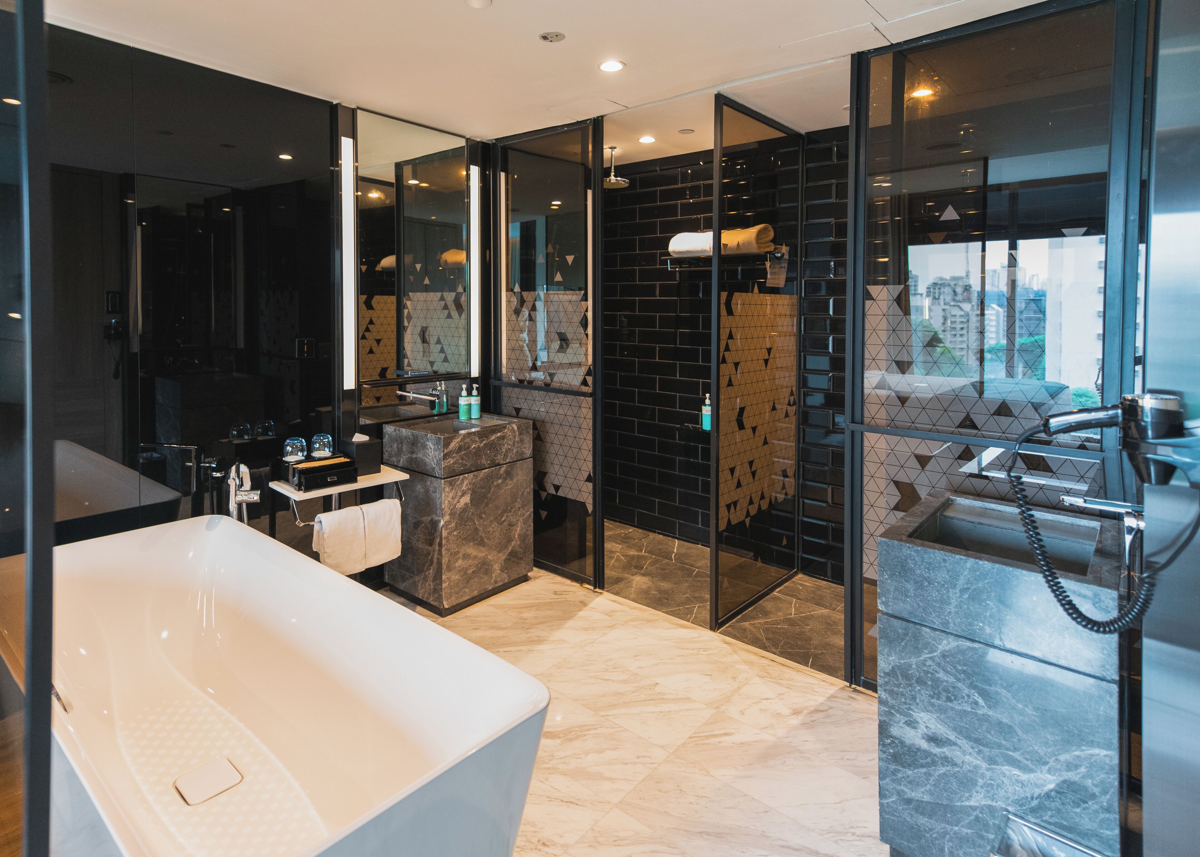 premier suite, 1 king bed | bathroom | rainfall showerhead, eco-friendly toiletries, hair dryer, bathrobes