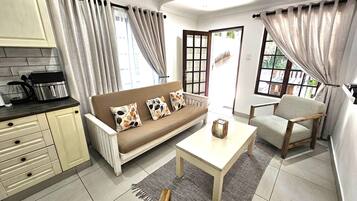 Family Studio Suite, 1 Bedroom, Patio, Ground Floor | Living area