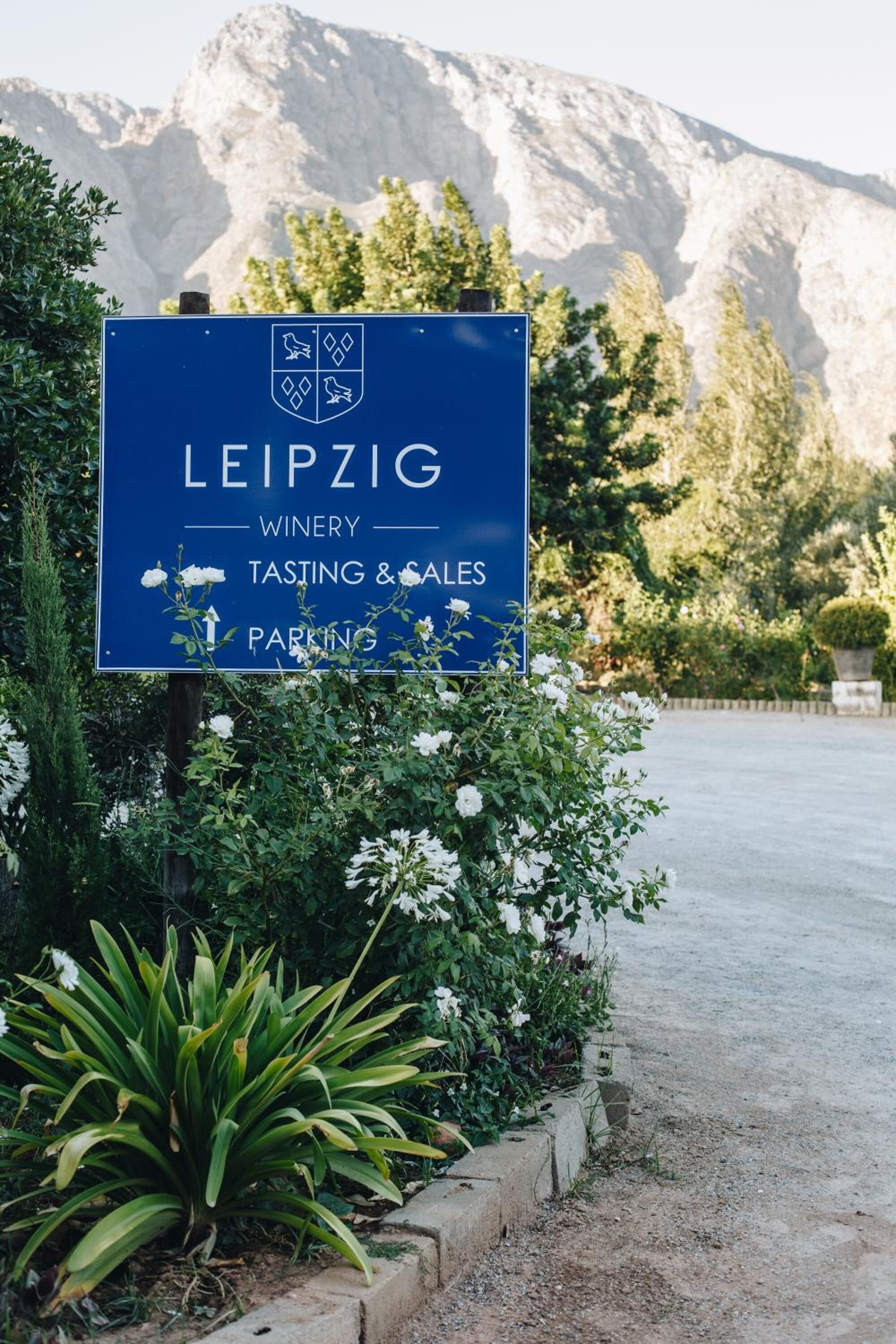 A sign for the Leipzig Winery, indicating tasting and sales, and parking.
