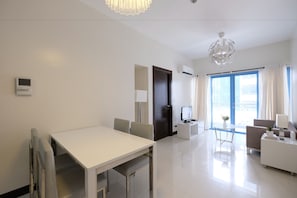 Standard Room | Living area | Flat-screen TV - StayHome Asia at Two Central (Makati)