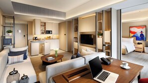 A modern hotel room with a living area, kitchenette, and a bedroom. - Artyzen Habitat Dongzhimen Beijing (Beijing)